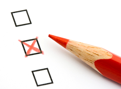 Red pencil and questionnaire